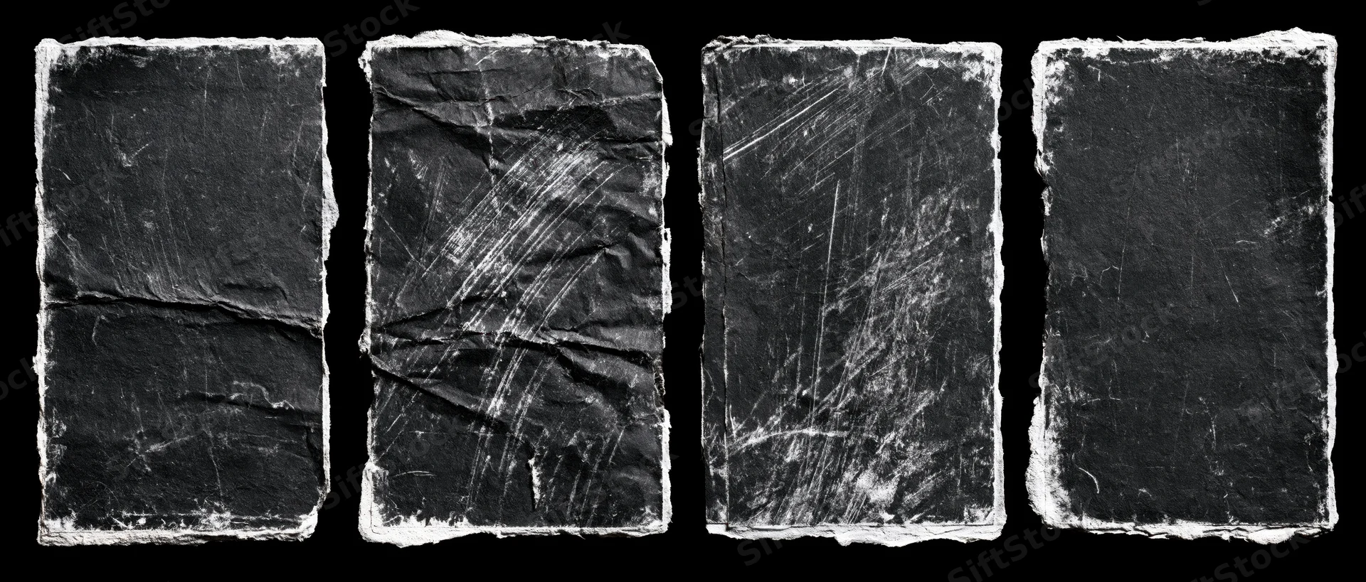 Four worn black paper rectangles arranged side by side on black background