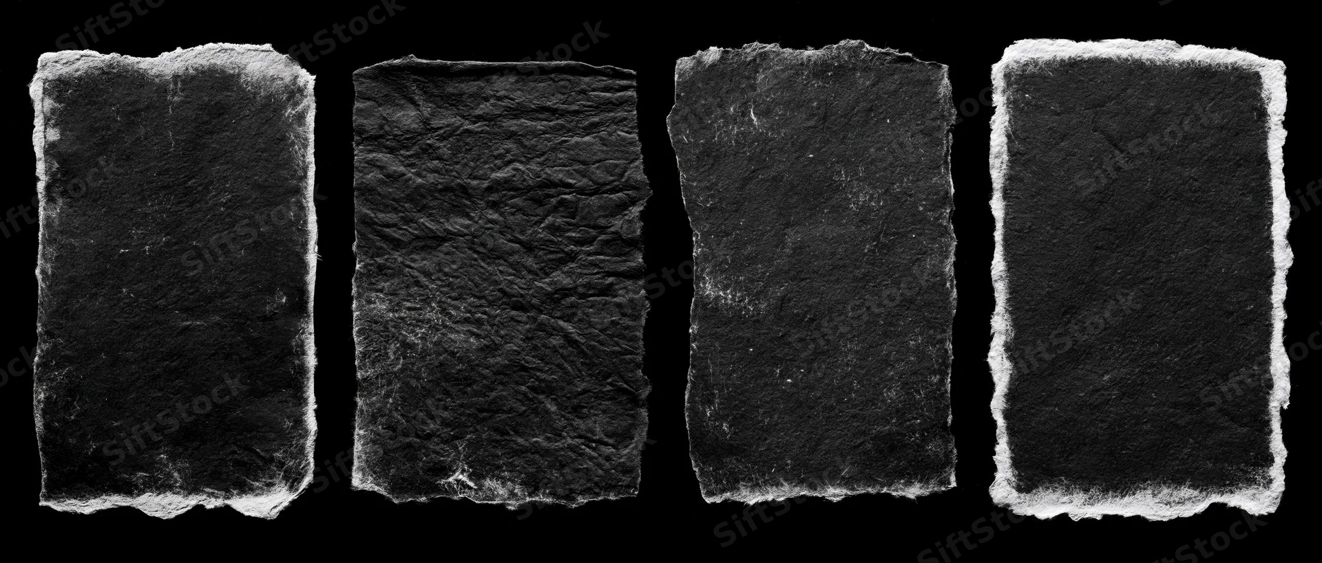 Four worn black paper rectangles arranged side by side on black background