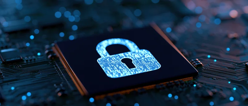 Glowing padlock icon on a dark circuit board surface