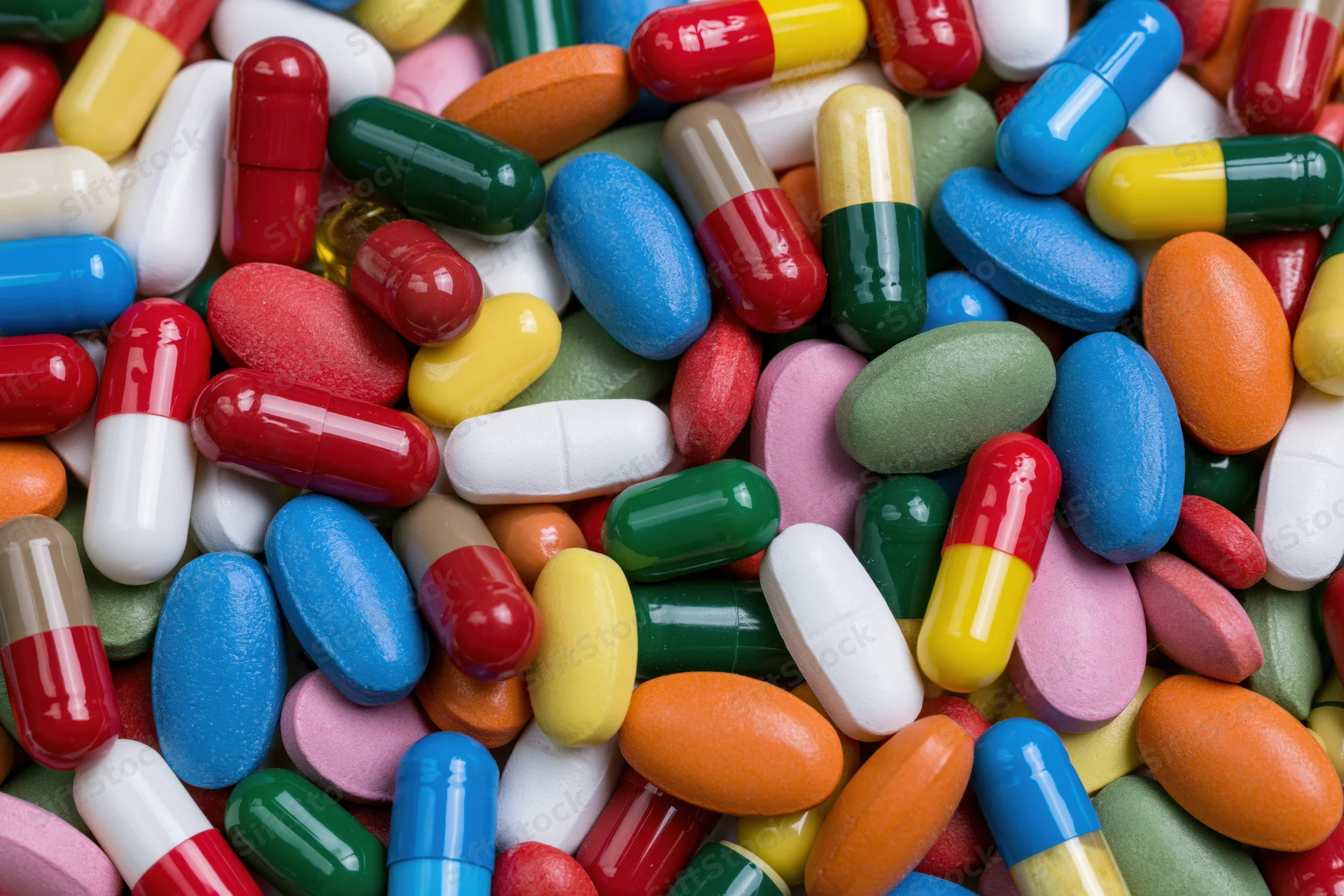 Closeup of assorted colorful pharmaceutical pills and capsules piled together