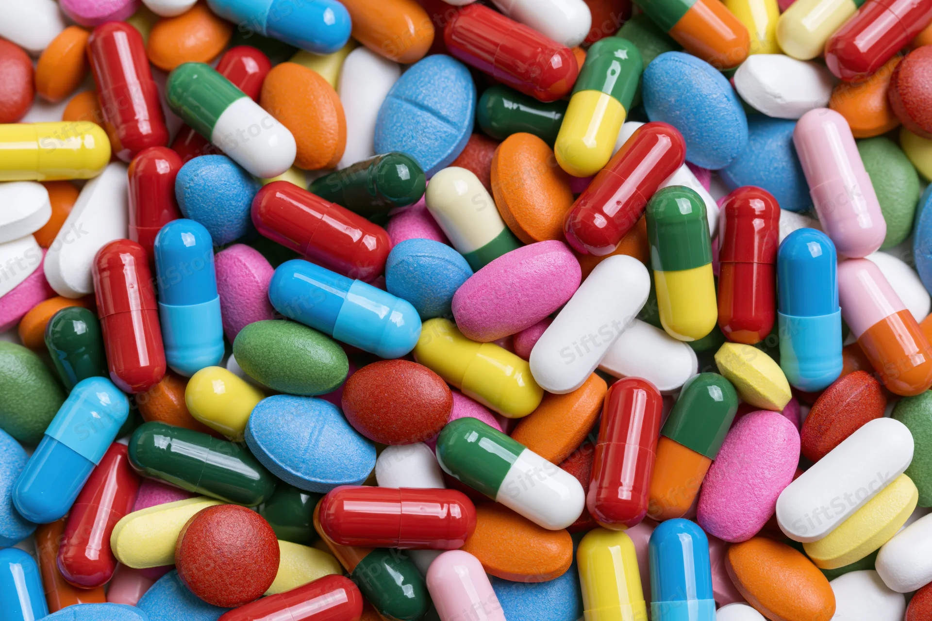 Closeup of assorted colorful pharmaceutical pills and capsules piled together