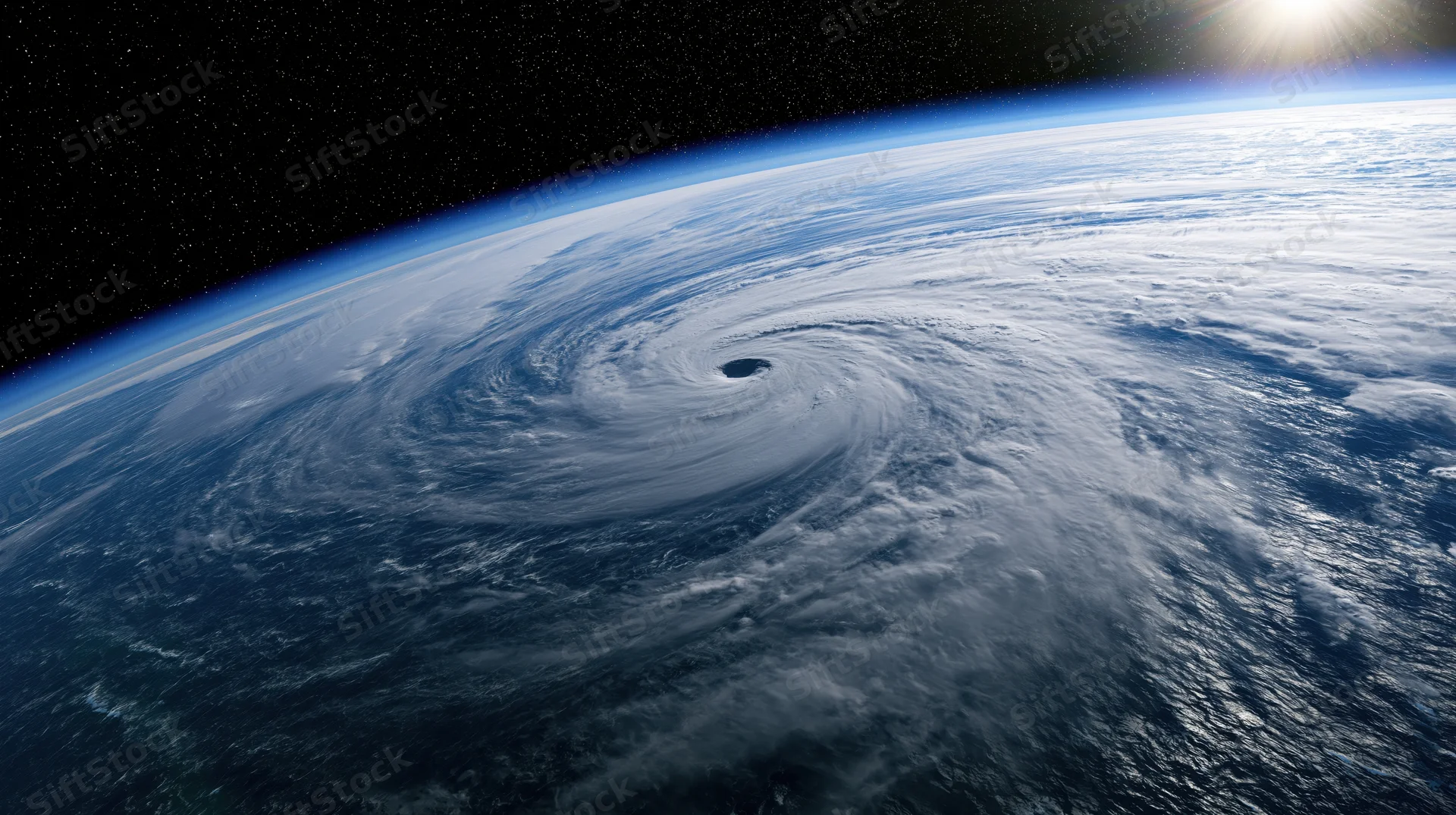 Massive hurricane swirling over earth's ocean surface viewed from low earth orbit