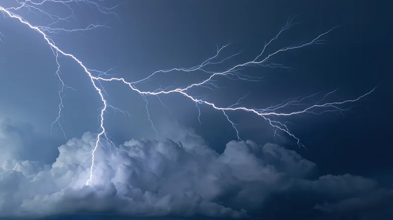 Lightning bolts branching across a dark stormy sky at night