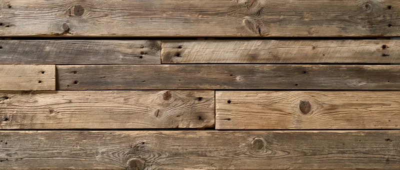 Reclaimed wood planks arranged horizontally as a textured wall surface