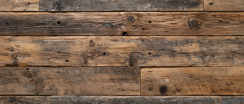 Reclaimed wood planks arranged horizontally as a textured wall surface