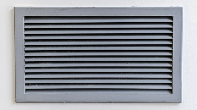 Rectangular metal vent grille with horizontal louvers mounted on a white wall