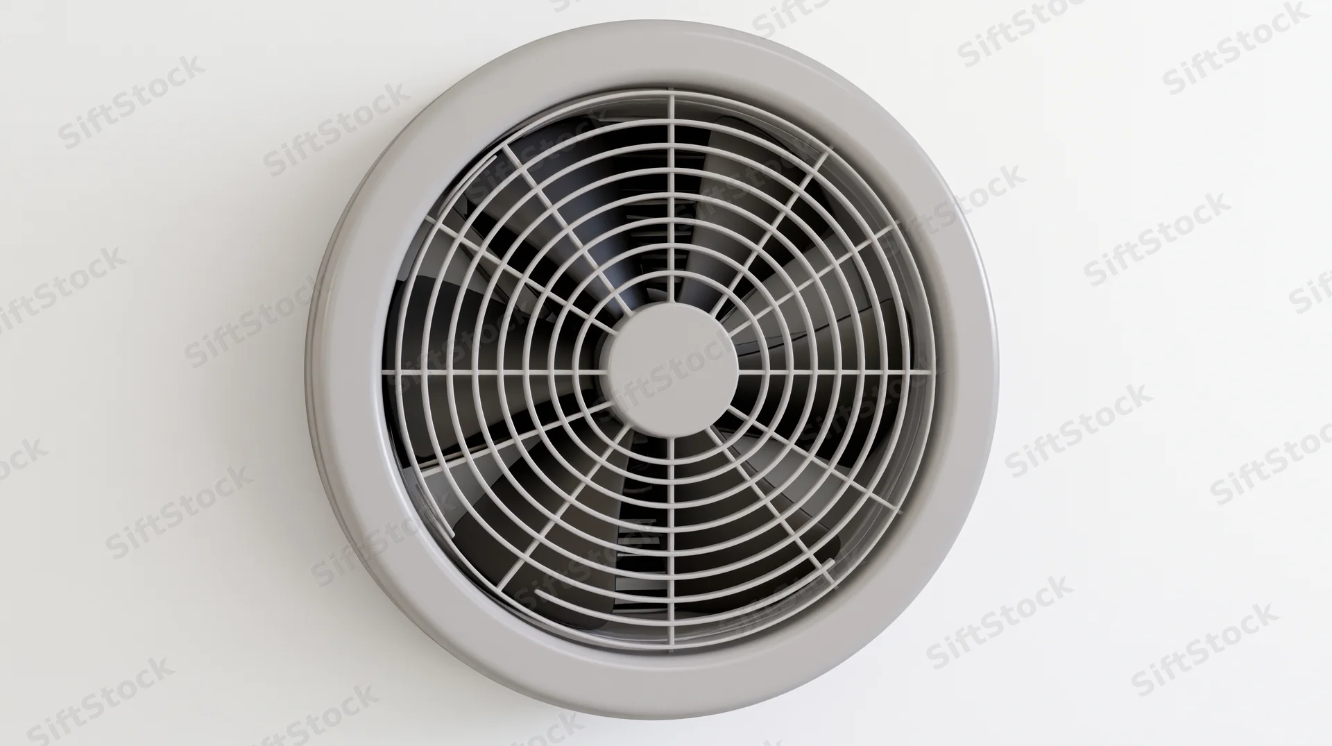 Round exhaust fan with plastic grille mounted on white ceiling