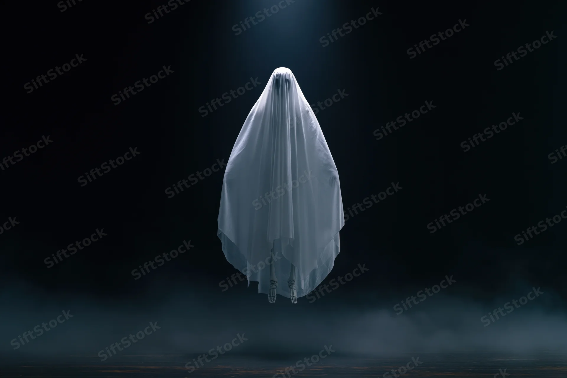 Ghost in white sheet floating in dark smoky space under spotlight