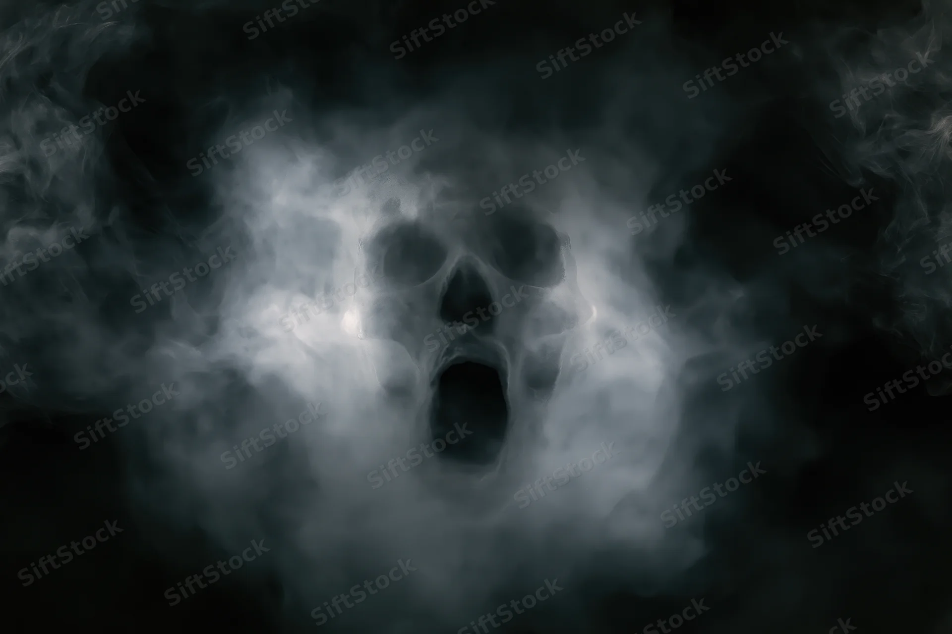 Ghostly skull emerging from swirling smoke and fog in dark atmosphere