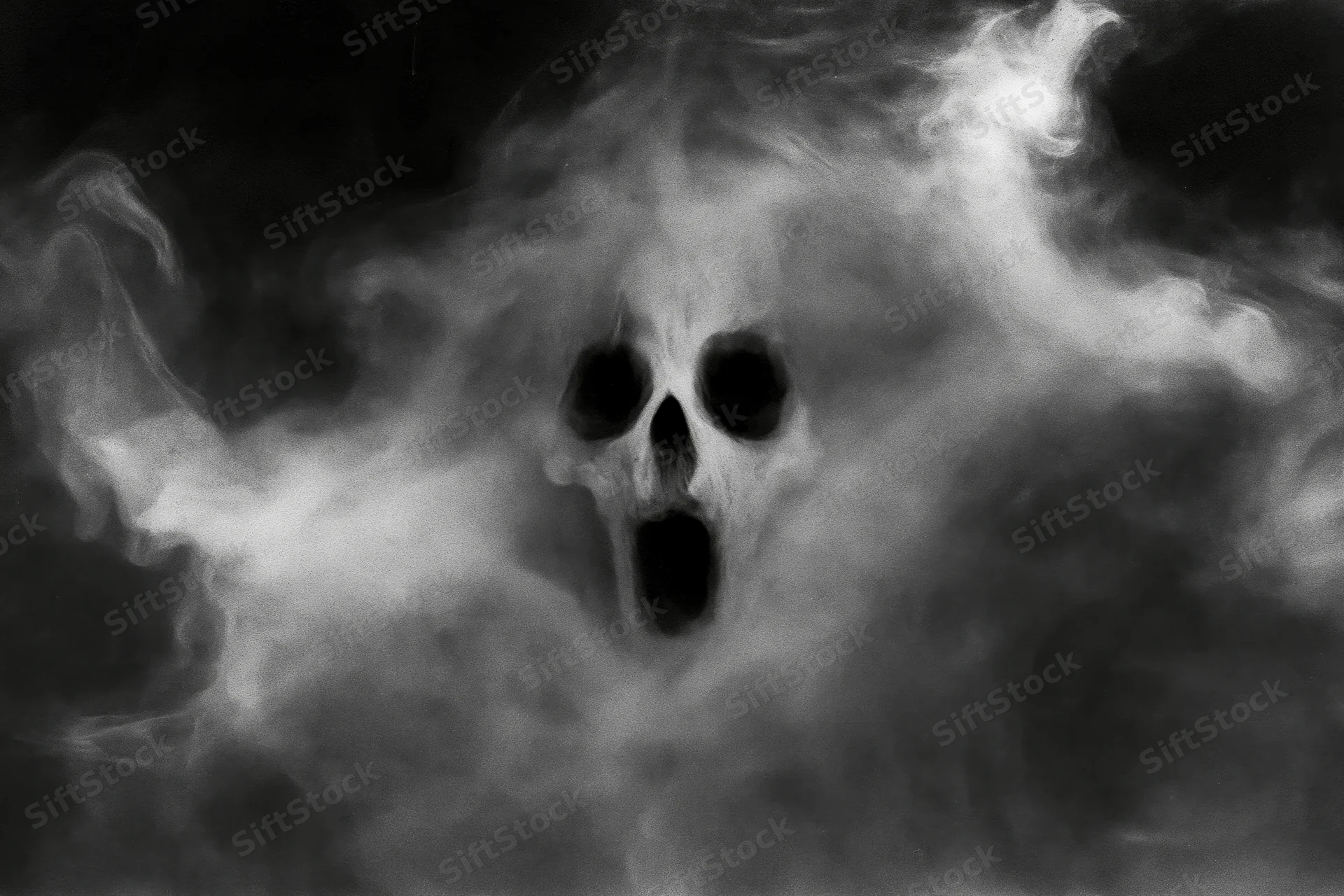 Skull emerging from swirling smoke in dark eerie atmosphere