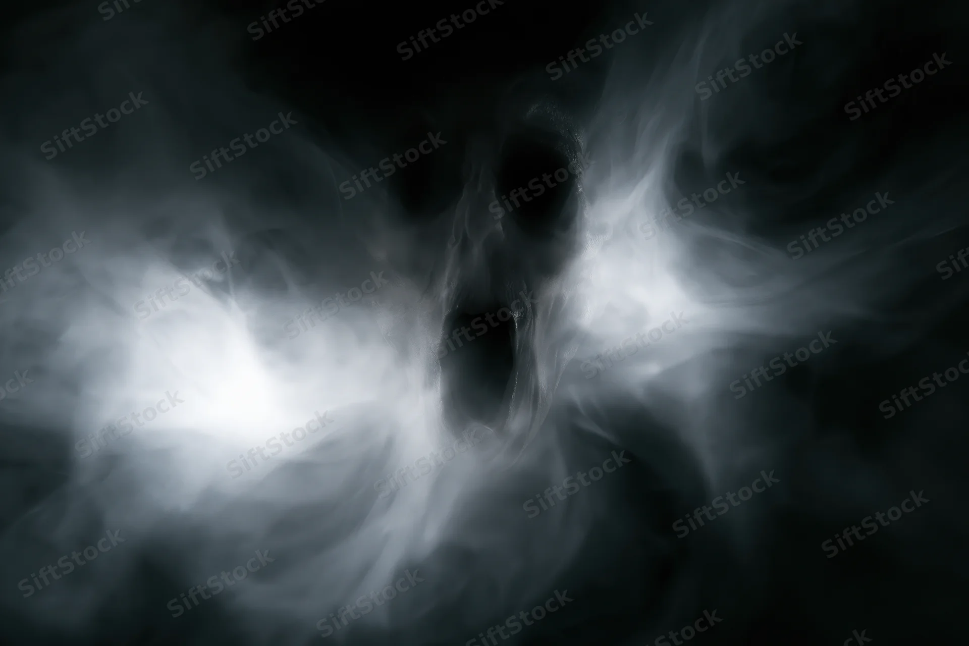 Ghostly screaming face emerging from swirling white smoke in dark atmosphere