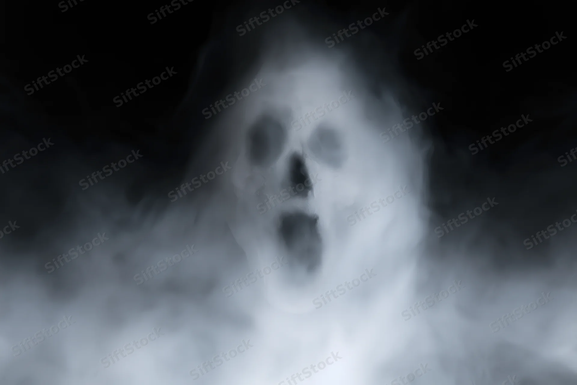 Ghostly screaming face emerging from swirling white smoke in dark atmosphere