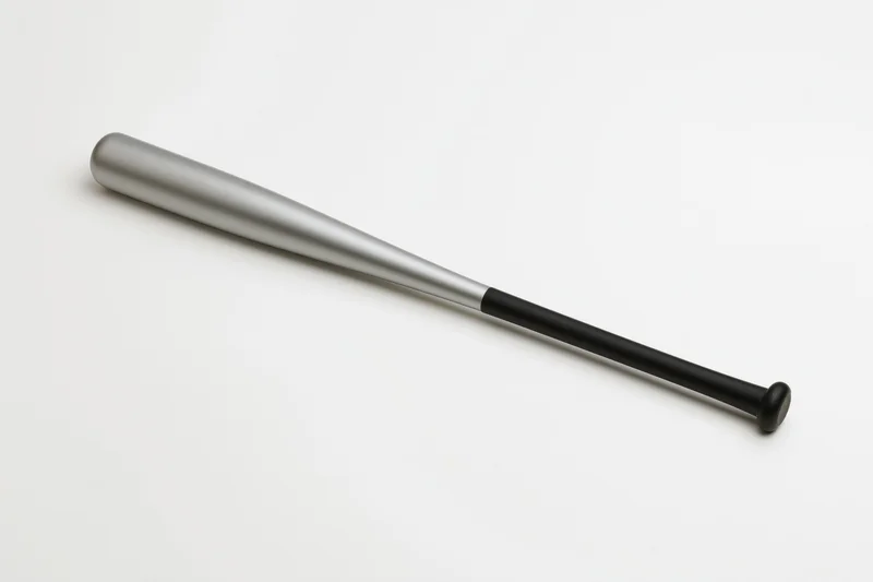 Aluminum baseball bat lying diagonally on white background