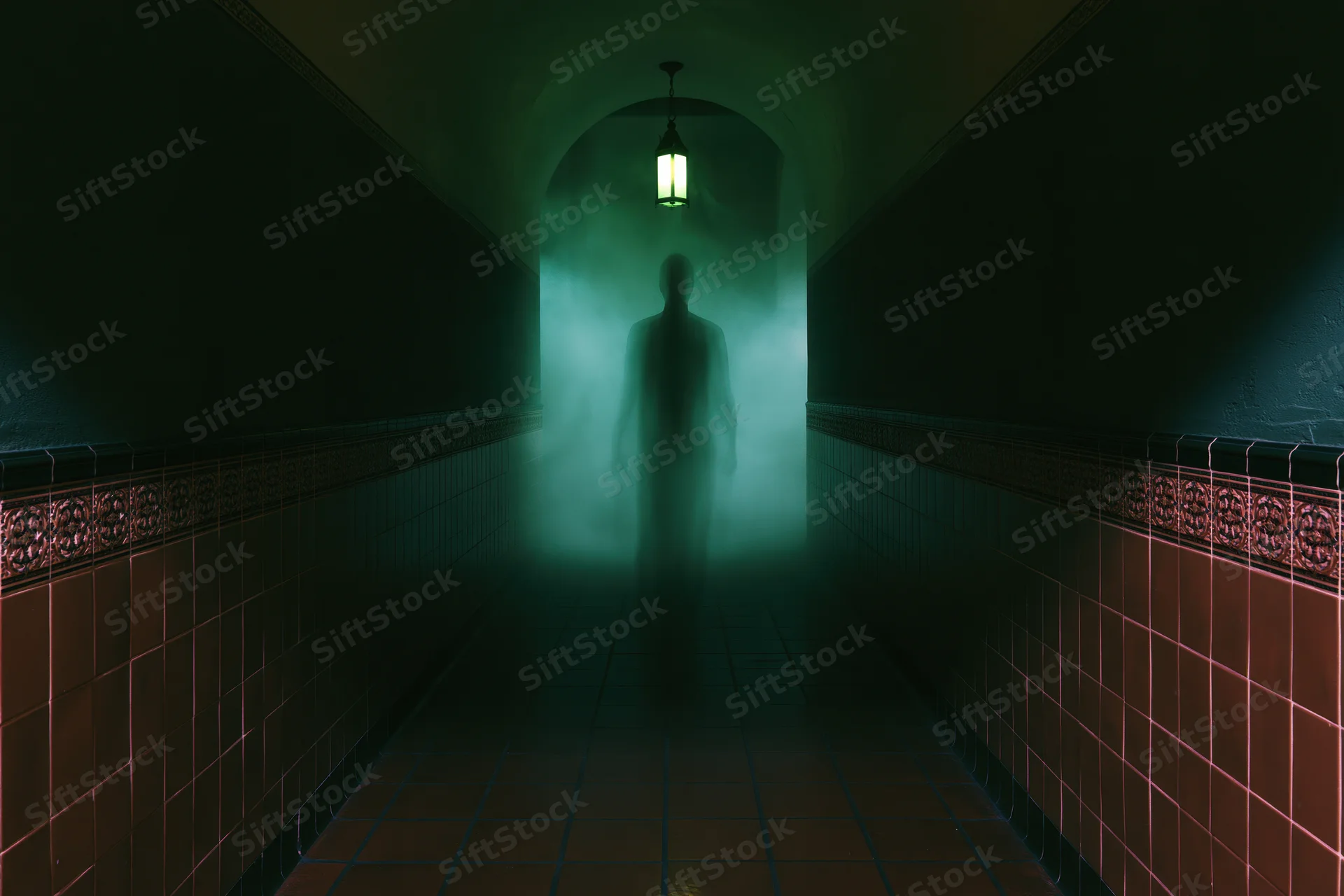 Translucent ghostly human silhouette standing in a foggy dimly lit hallway with green lantern light