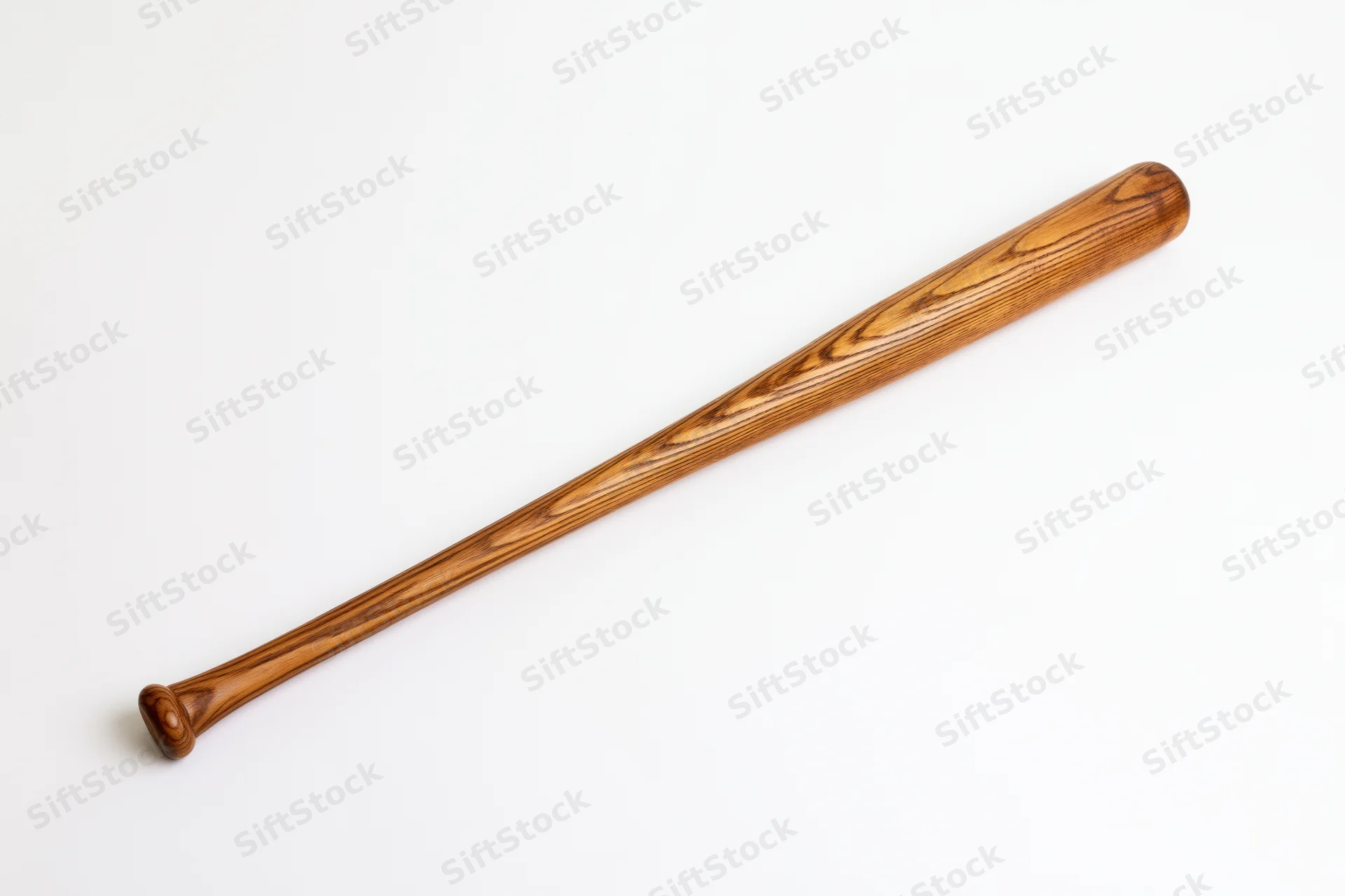Wooden baseball bat resting diagonally on white background