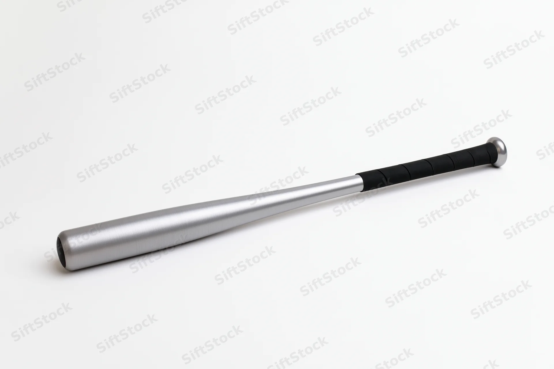 Aluminum baseball bat lying diagonally on white background