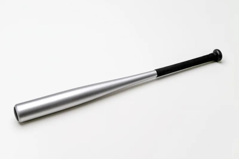 Aluminum baseball bat lying diagonally on white background