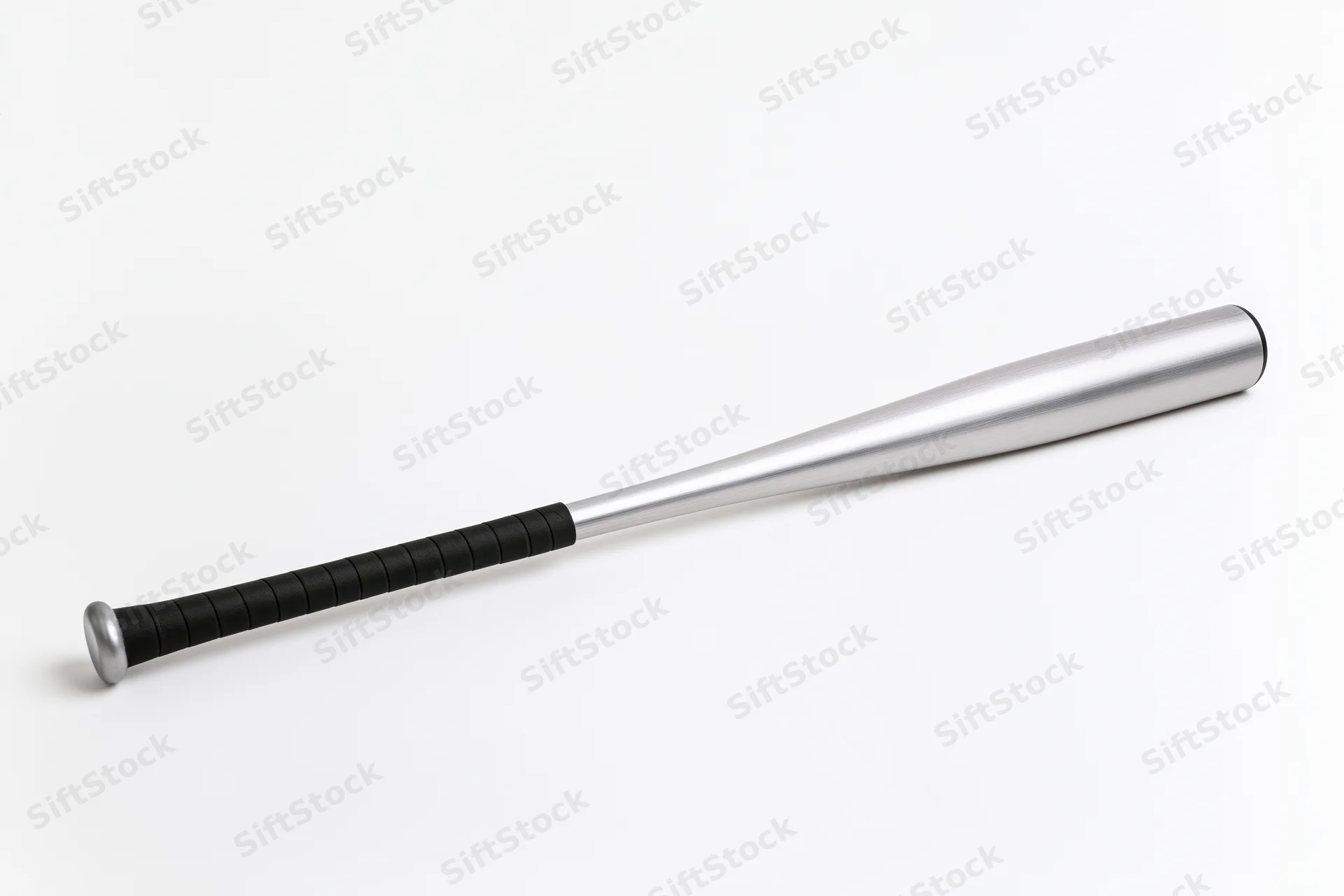 Aluminum baseball bat lying diagonally on white background