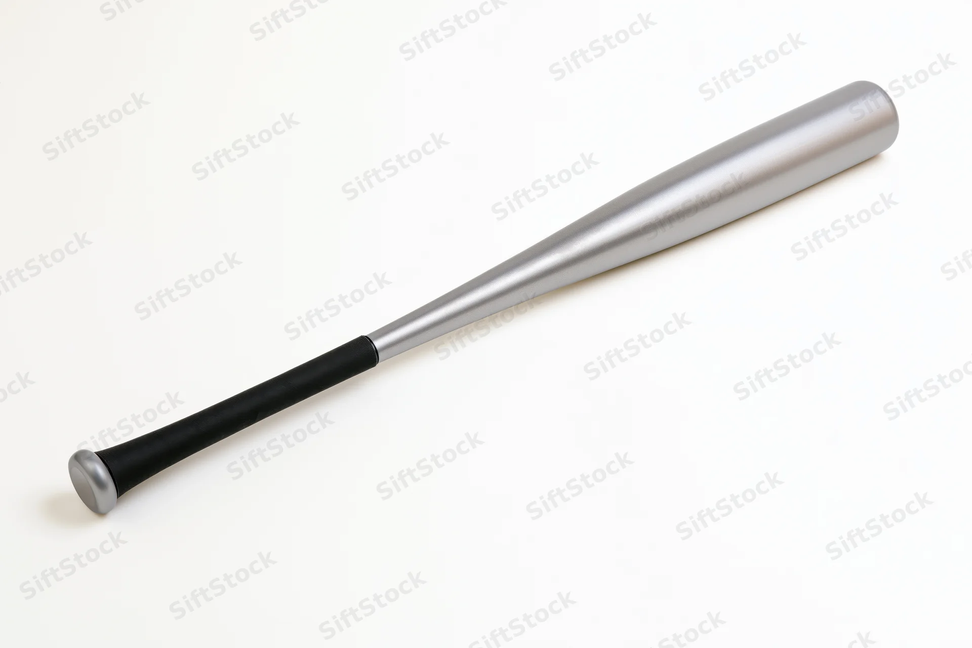 Aluminum baseball bat lying diagonally on white background