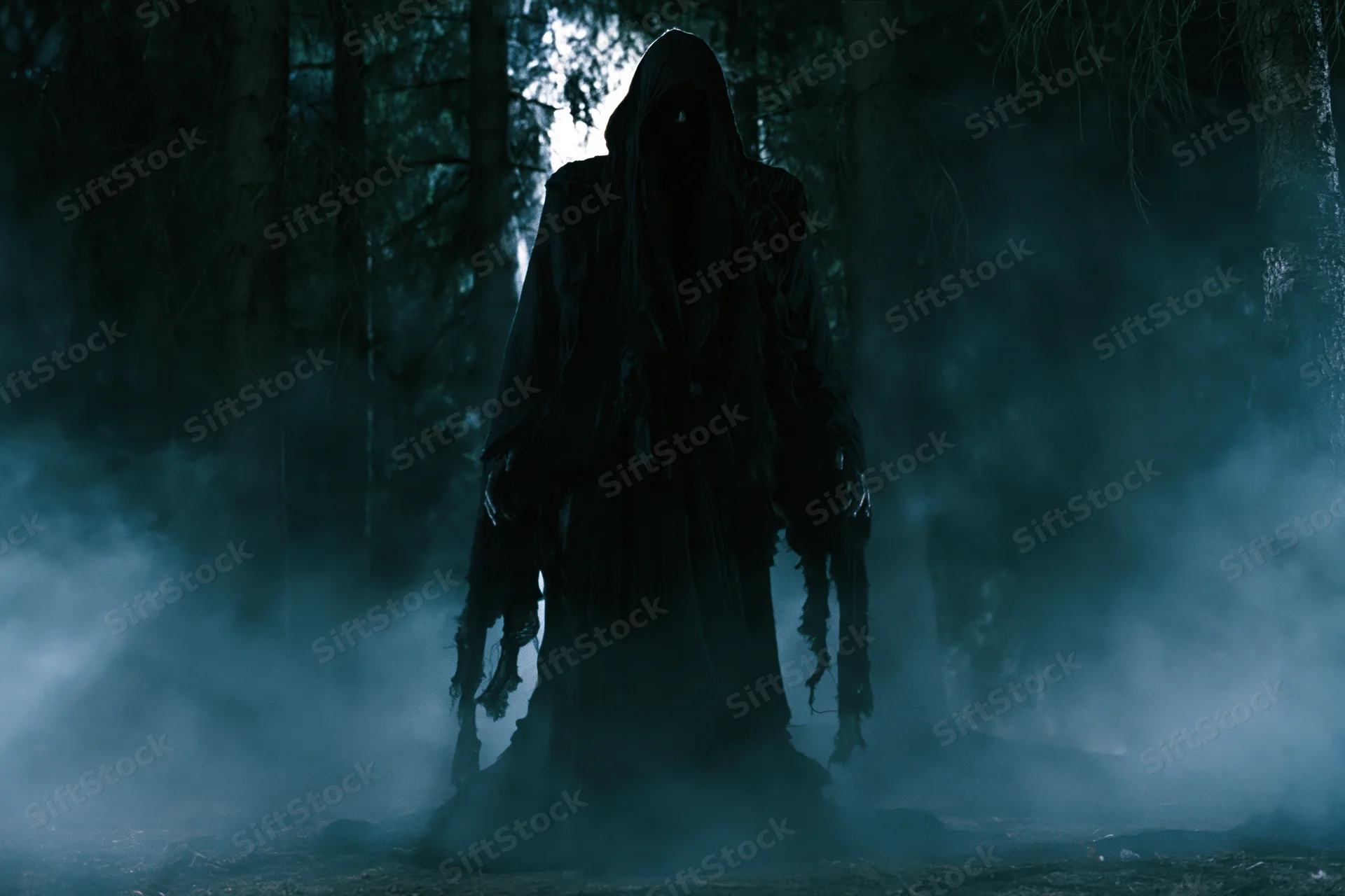 Dark hooded figure standing motionless in misty forest at night