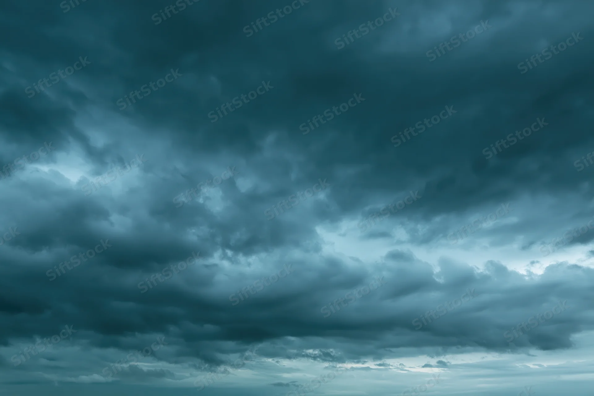 Dramatic overcast sky filled with layered cumulus and stratus clouds