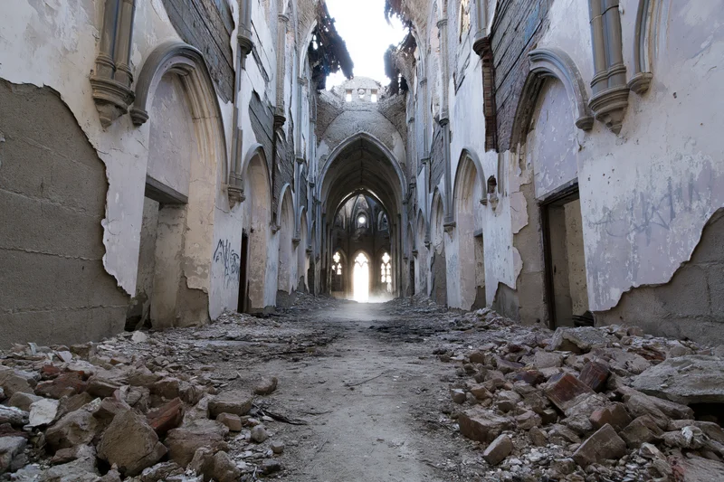 Crumbling gothic hallway with arched ceilings and rubble-covered floor in abandoned building