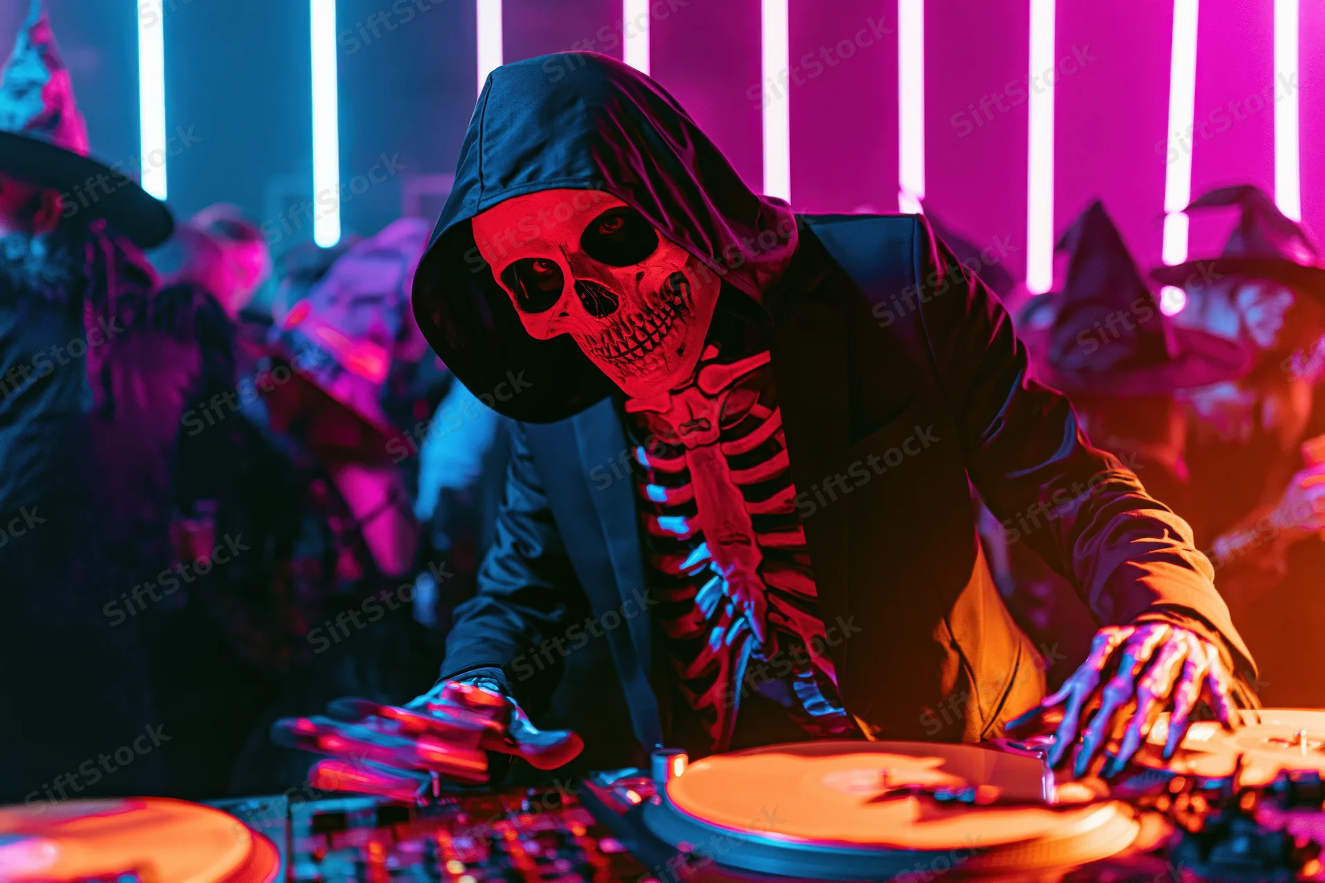 Skeleton-costumed dj mixing music at a neon-lit halloween party