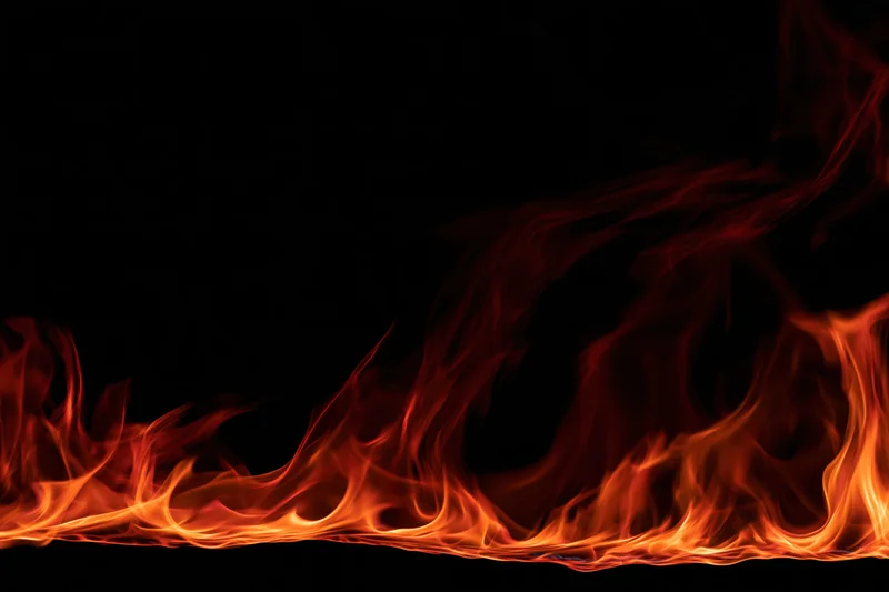 Flames burning along the bottom edge against a black background