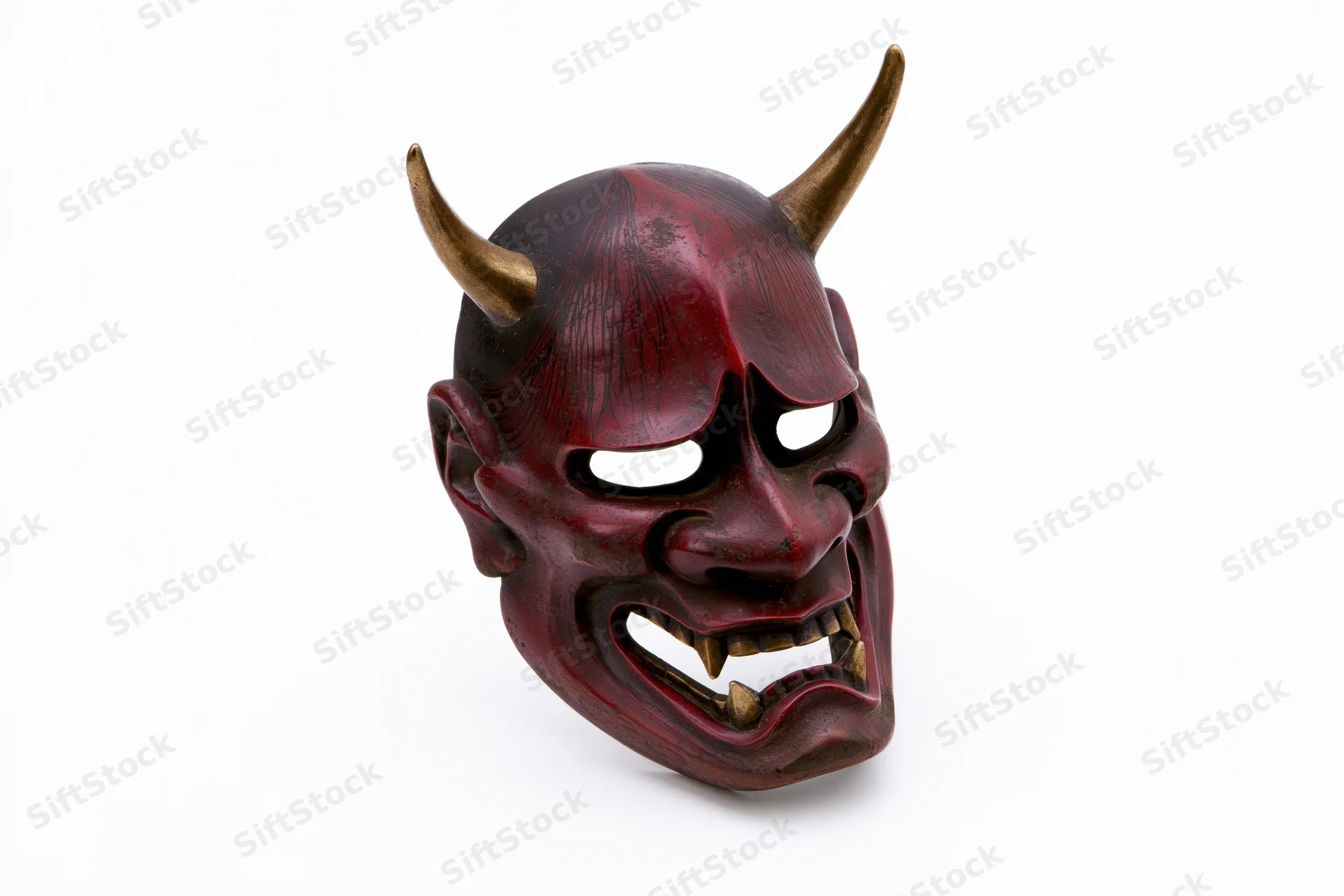 Traditional japanese hannya noh theater mask with horns and red lacquered finish isolated on white background