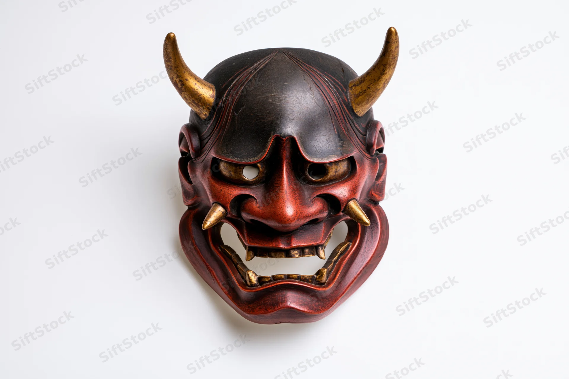 Traditional japanese hannya demon mask displayed face-forward on white background