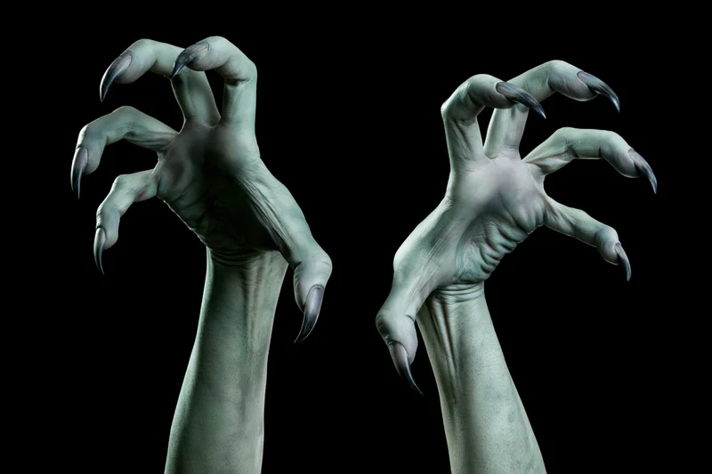 Two pale green monster hands with sharp claws reaching upward against black background