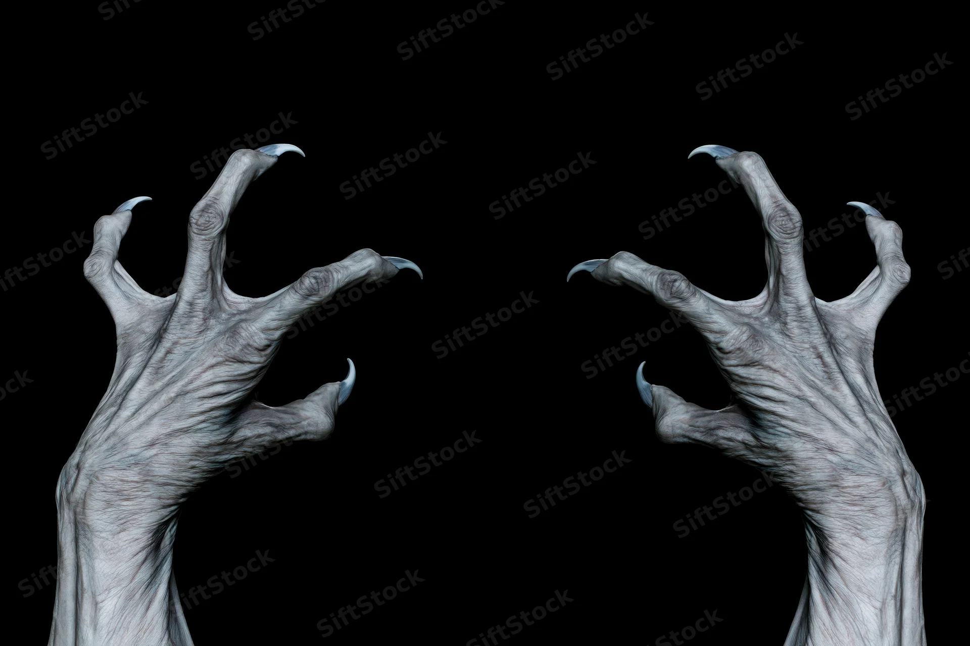 Two pale grey monster hands with long sharp claws reaching upward against black background