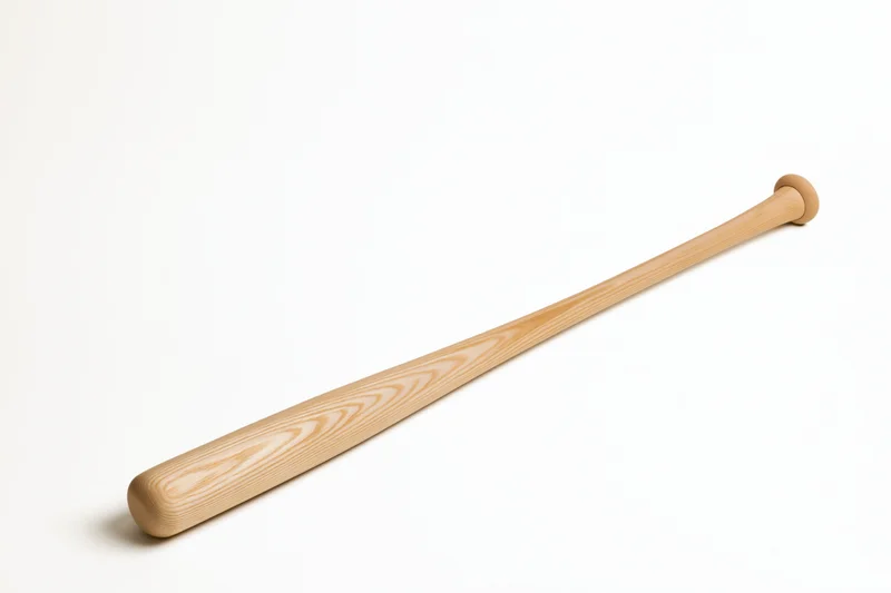 Unfinished wooden baseball bat lying diagonally on white background