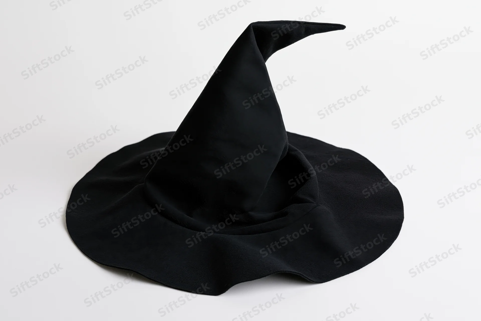 Black fabric witch hat with tall pointed crown and wide brim on white background