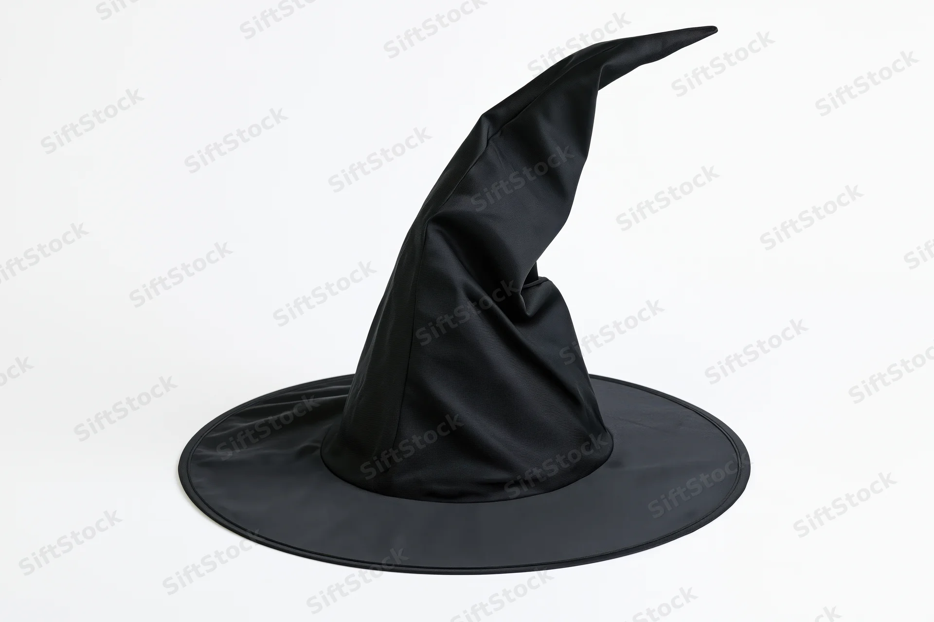 Black pointed witch hat with crumpled fabric on white background