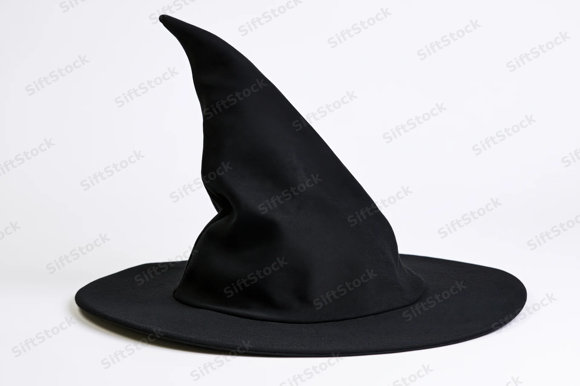 Black witch hat with tall crooked pointed crown and wide brim on white background