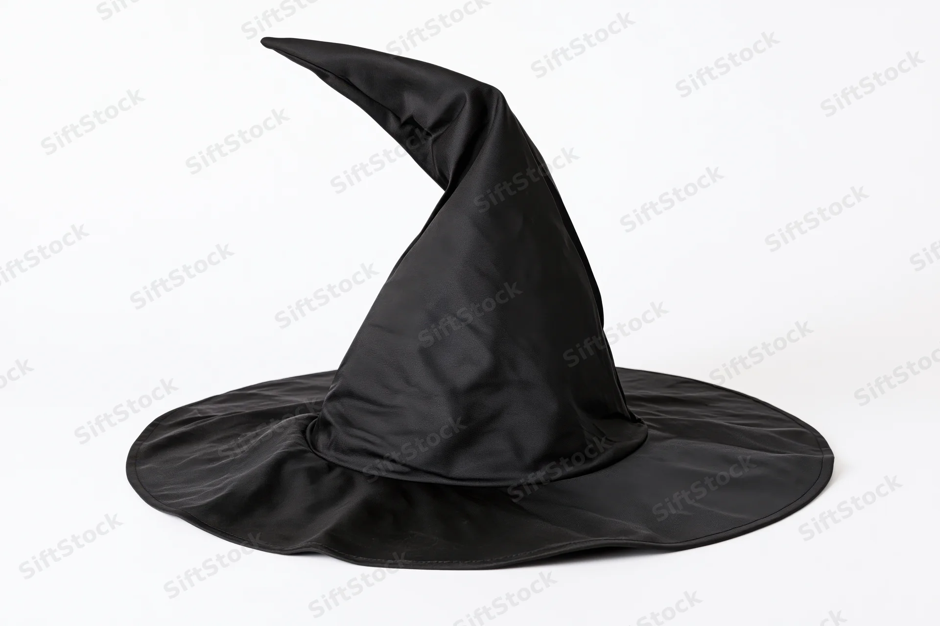 Black witch hat with tall curved pointed crown and wide brim on white background