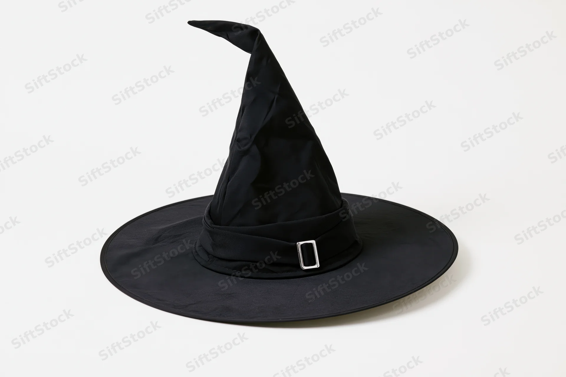 Black witch hat with tall pointed crown and wide brim on white background