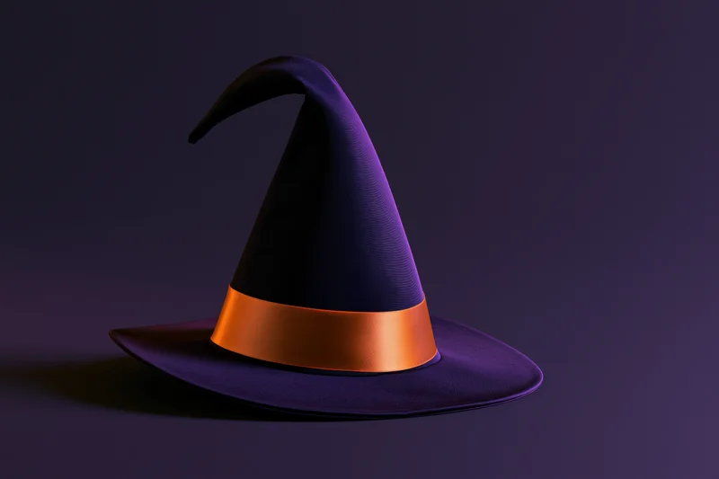 Dark purple witch hat with curved tip and orange ribbon on a dark background