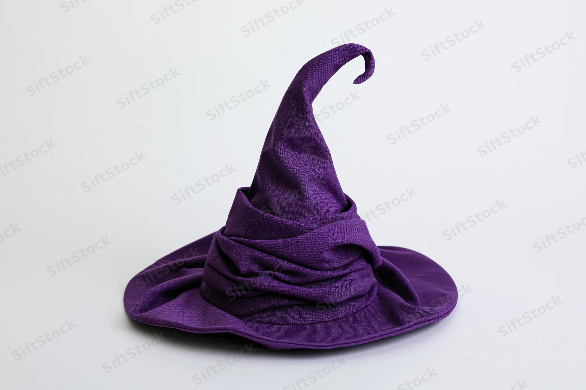 Deep purple fabric witch hat with tall curling tip on white background