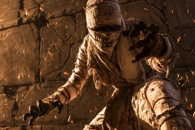 Mummy wrapped in aged linen bandages lunging forward in a crumbling stone tomb with sparks flying around