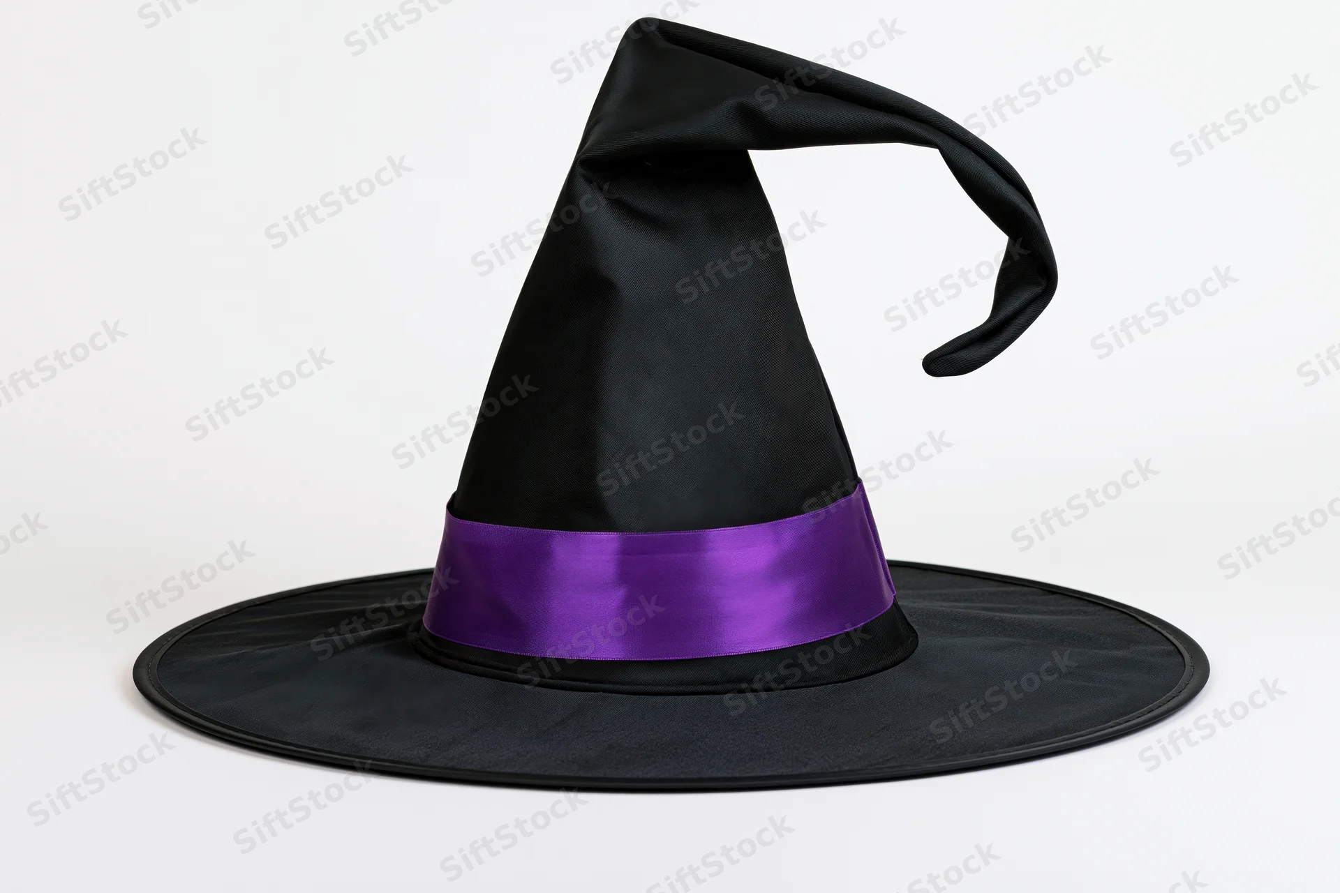 Tall black witch hat with purple satin band and curved drooping tip on white background