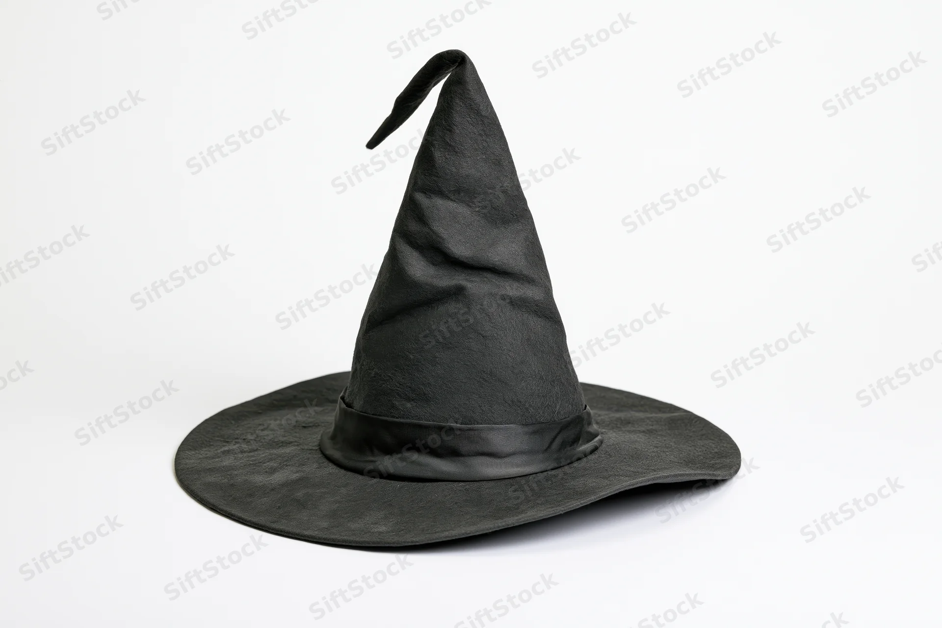 Black pointed witch hat slightly tilted on white background