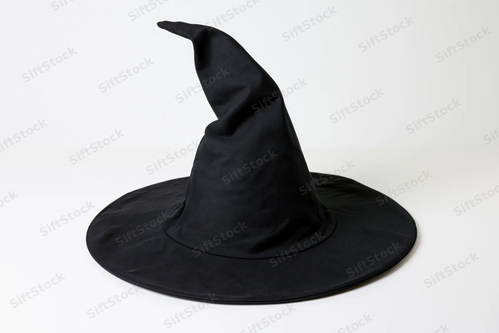 Black fabric witch hat with tall pointed crown and wide brim on white background