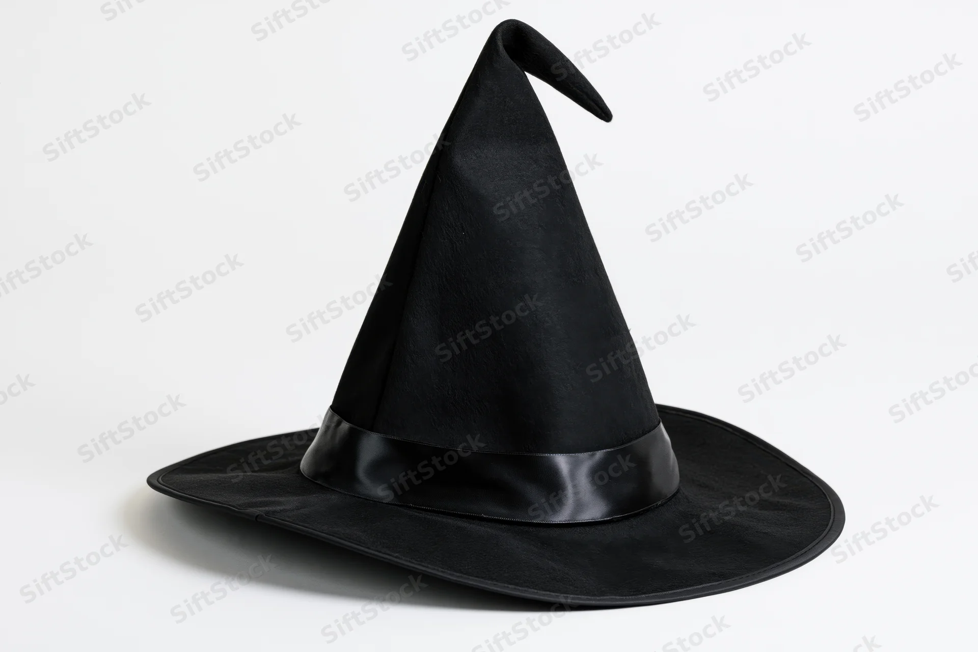 Black witch hat with tall pointed crown and wide brim on white background