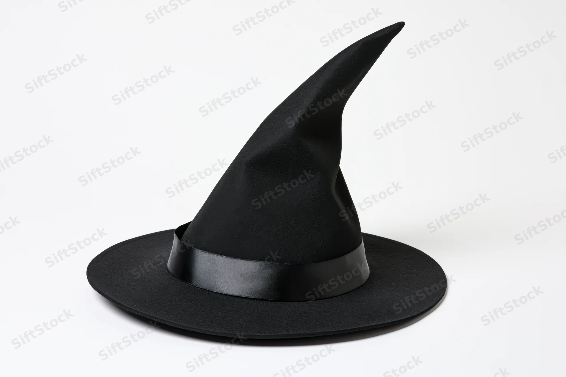 Black witch hat with tall pointed crown and wide brim on white background