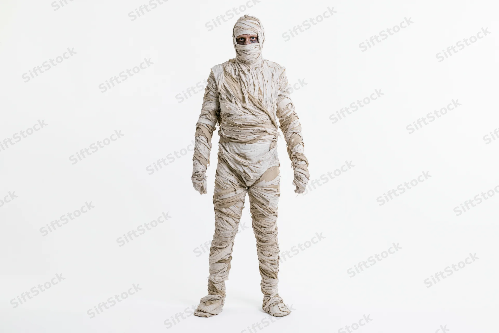 Person in full-body mummy costume standing upright against white background