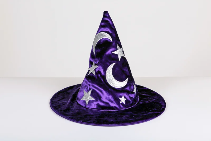 Purple velvet wizard hat with silver glitter moons and stars on white background
