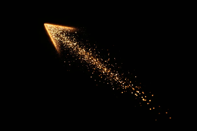 Glowing golden arrow made of scattered particles pointing upward against black background
