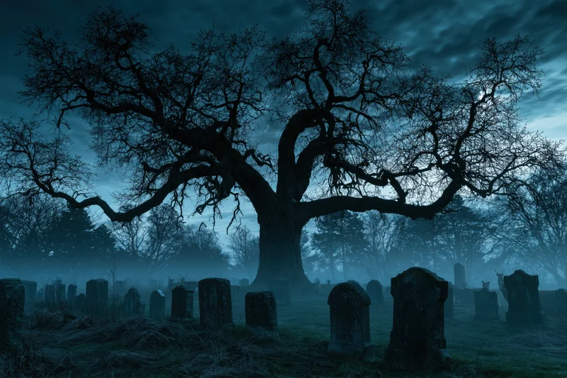 Ancient oak tree with gnarled branches silhouetted over foggy graveyard at night